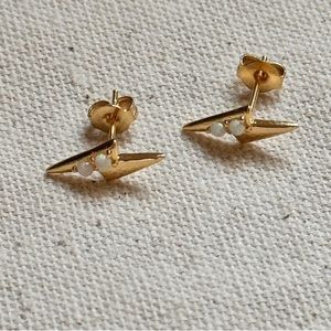 Tramps and thieves gold lightning bolt stud earrings with opal cz stones